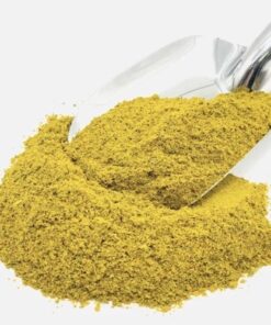 Pile of Fish Spice Mix with a large metal spice spoon with Fish Spice Mix on top