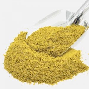 Pile of Fish Spice Mix with a large metal spice spoon with Fish Spice Mix on top