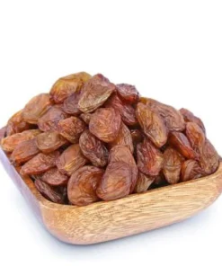 Brown wooden bowl filled with Yellow Besni Grape