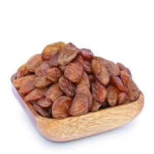 Brown wooden bowl filled with Yellow Besni Grape