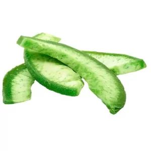 Green coloured Dried Pomelo pieces on a white background