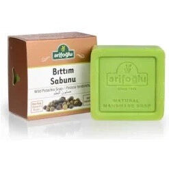 Bronze,white box with picture of Wild Pistachio Seednext to a square green bar of Natural Wild Pistachio Soap