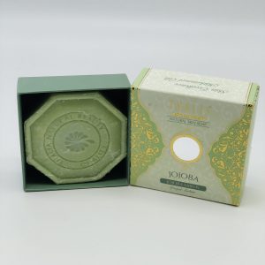 Open green, light green, golden box with hexagonal green Organic Jojoba Soap.