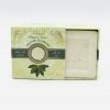 Half open light green box with dark green line and picture of Bay Leaf showing a square, white bar of Organic Bay Leaf Soap.