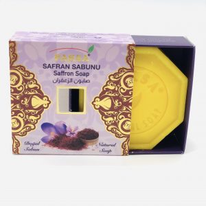 Half open purple golden box with Saffron flower and a hexagonal yellow coloured Organic Saffron Soap.