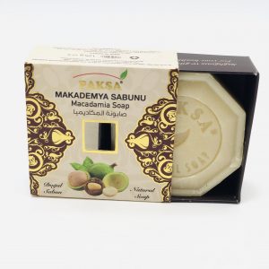 Box with Macadamia nuts slightly open showing a hexagonal Organic Macadamia Soap.