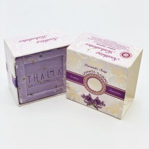Open beige, purple, golden box with Lavender showing a square bar of purple Organic Lavender Soap