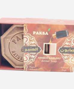 Half open brown golden box showing amber and inside a hexagonal brown Organic Amber Soap.