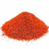 A pile of Ground Sweet Paprika on a white background