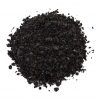Almost black coloured Smoked Paprika on a white background.